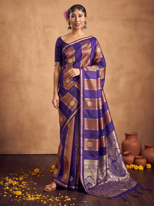 Woman wearing purple satin saree with traditional indian motif work and purple blouse