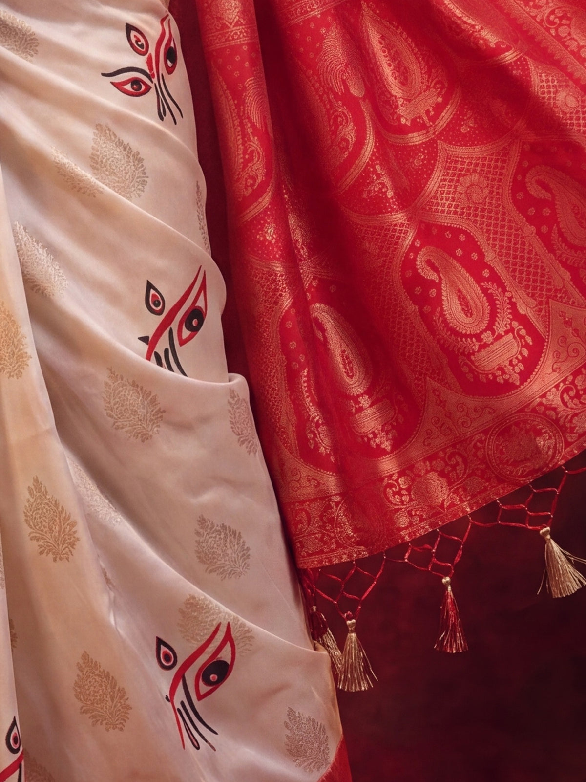 Pallu detail of off white satin silk saree showing all-over floral design and zari border