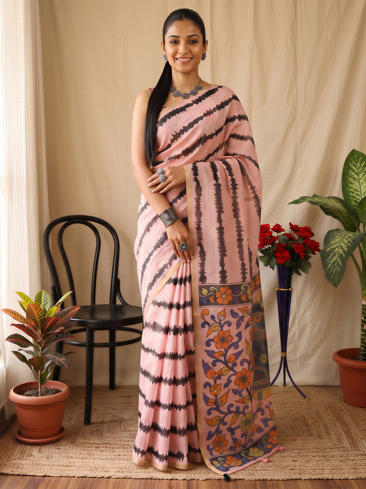 Woman wearing pink cotton blend saree with kalamkari narrative motif work and pink blouse