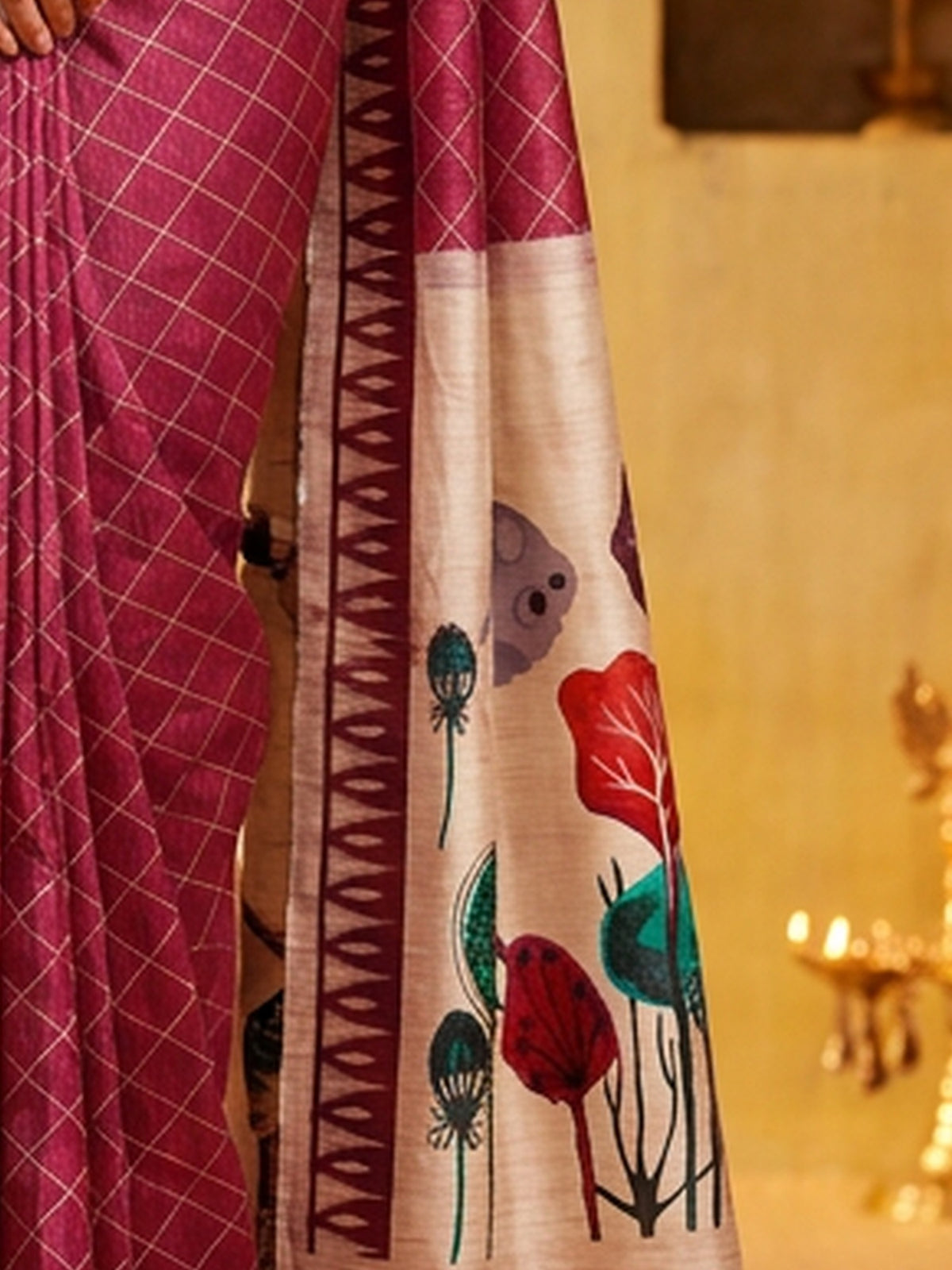 Pallu detail of mauve soft silk saree showing geometric pattern design and printed border