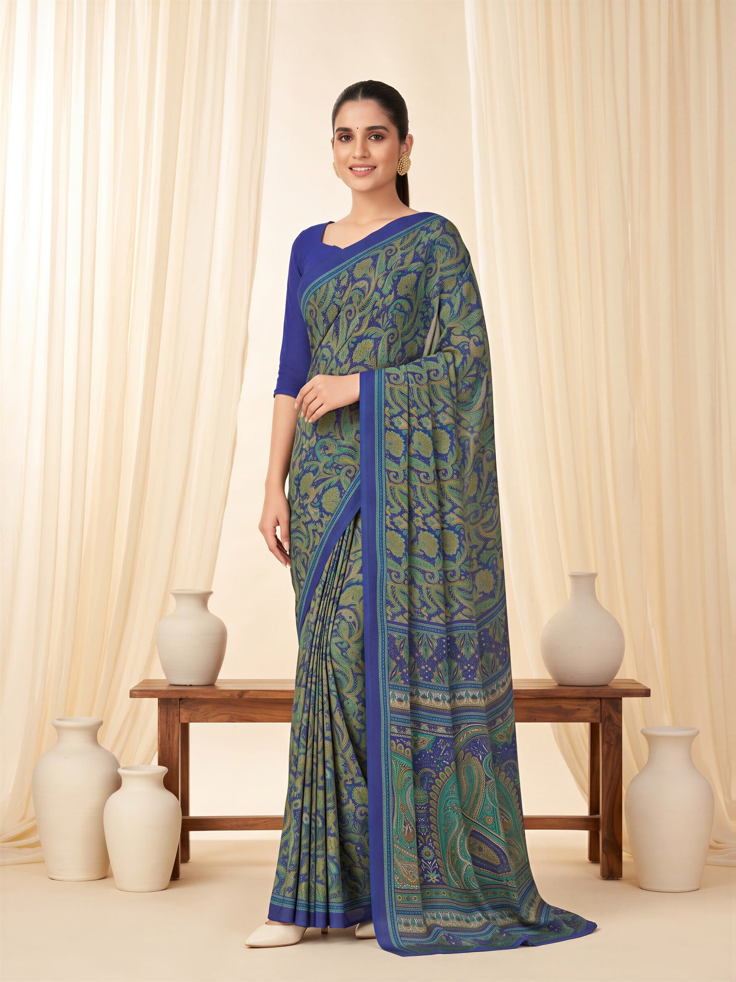 Woman wearing navy blue crepe saree with bagh block-print motif work and navy blue blouse