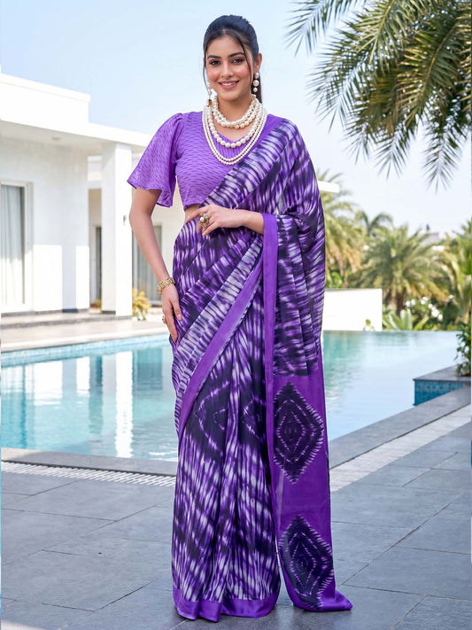 Woman wearing violet crepe saree with shibori resist-dye pattern and violet blouse