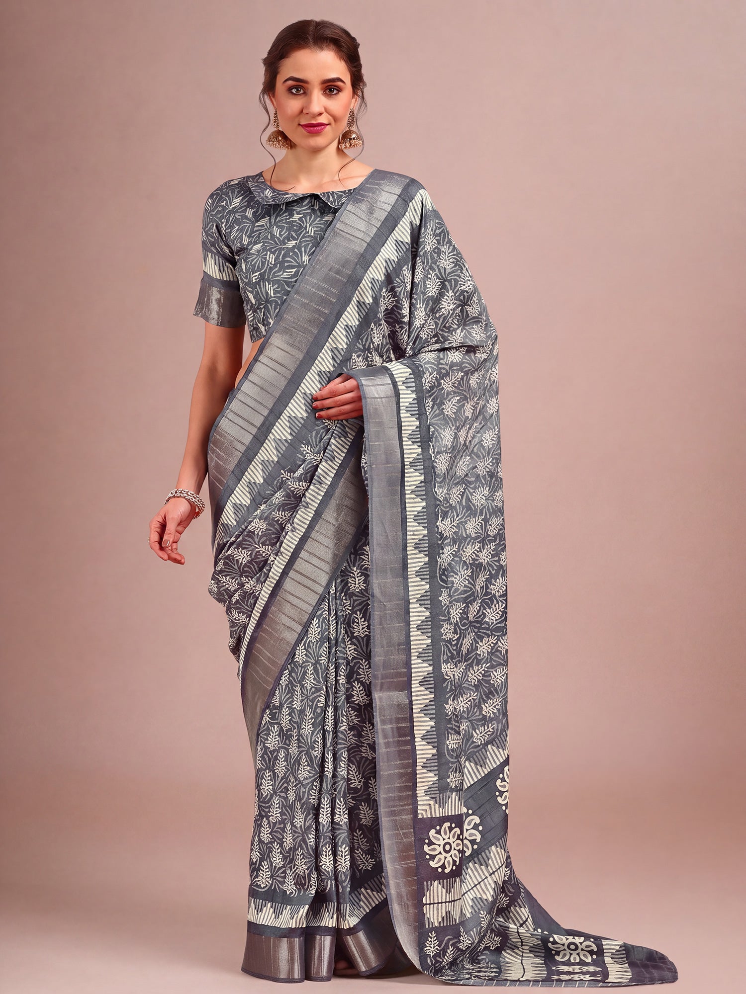 Woman wearing grey cotton silk saree with traditional indian motif work and grey blouse