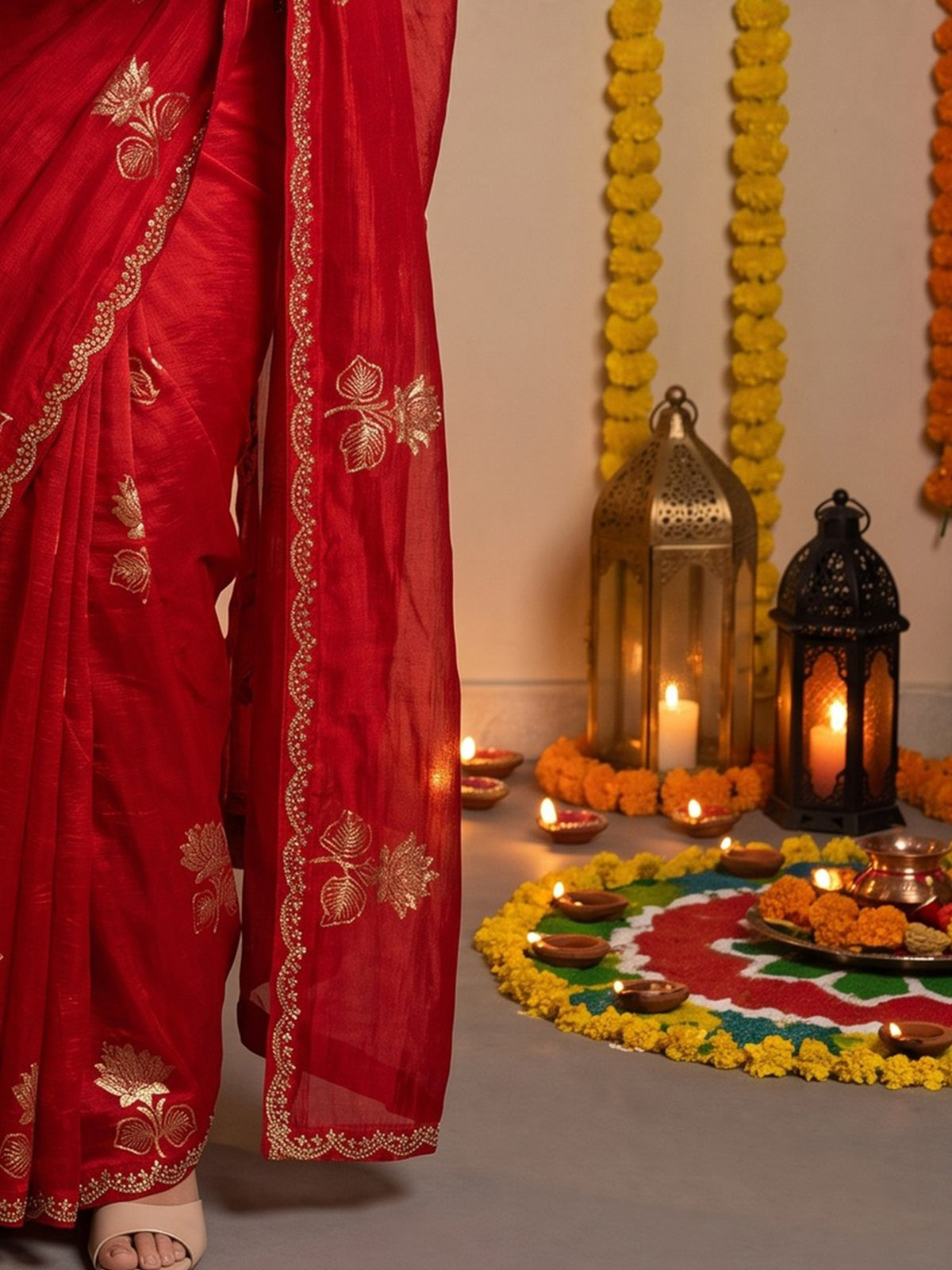 Pallu detail of red georgette saree showing metallic foil print work and embellished border