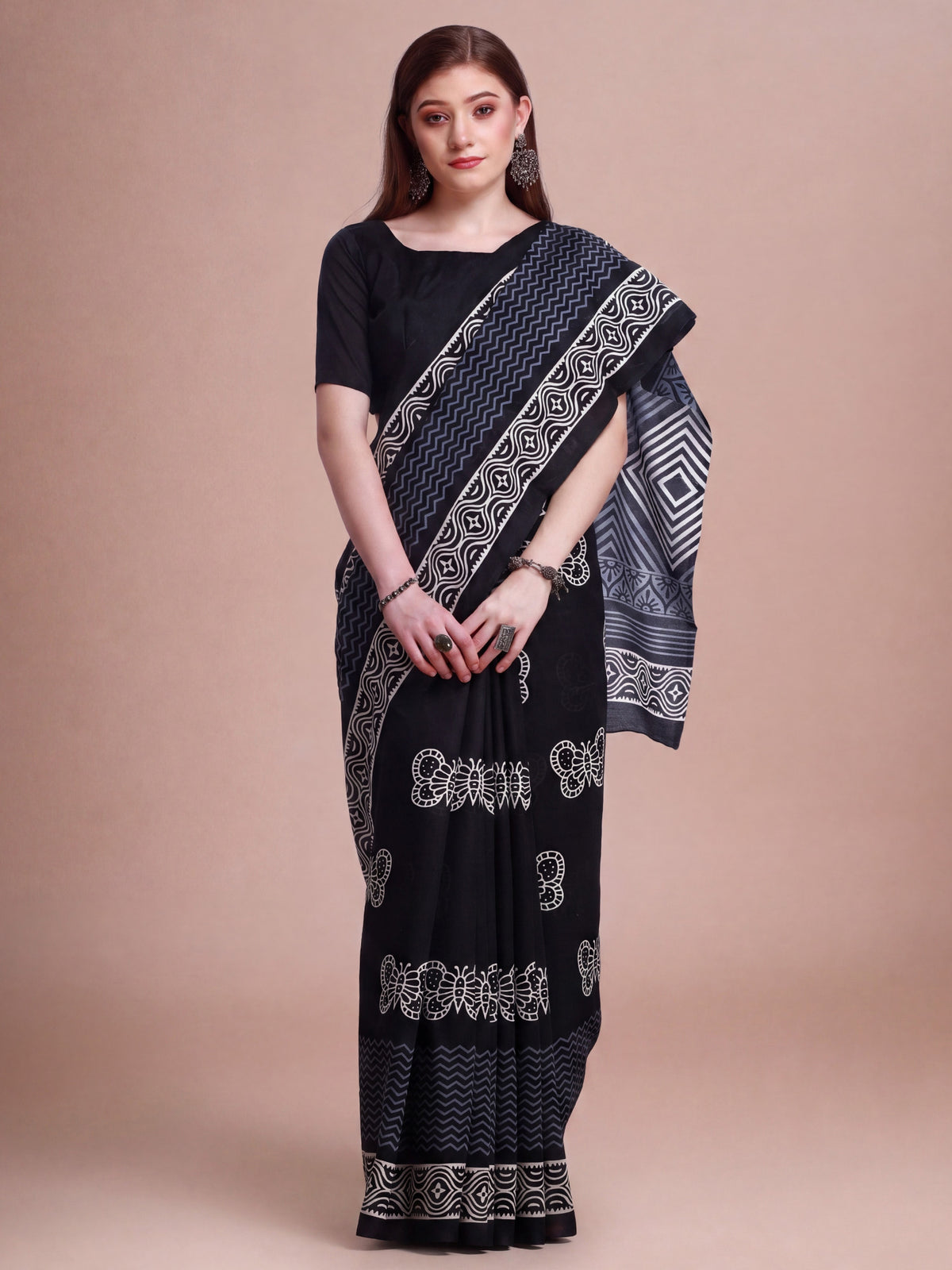 Woman wearing black bhagalpuri silk saree with bagh block-print motif work and black blouse