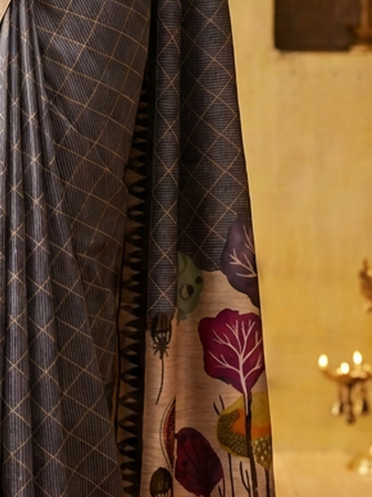 Pallu detail of grey soft silk saree showing geometric pattern design and printed border