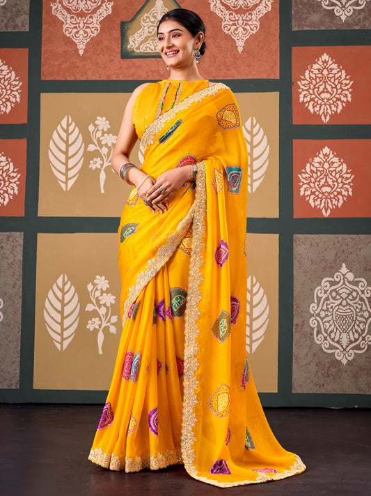 Woman wearing yellow chiffon saree with bandhani tie-dye dot work and yellow blouse