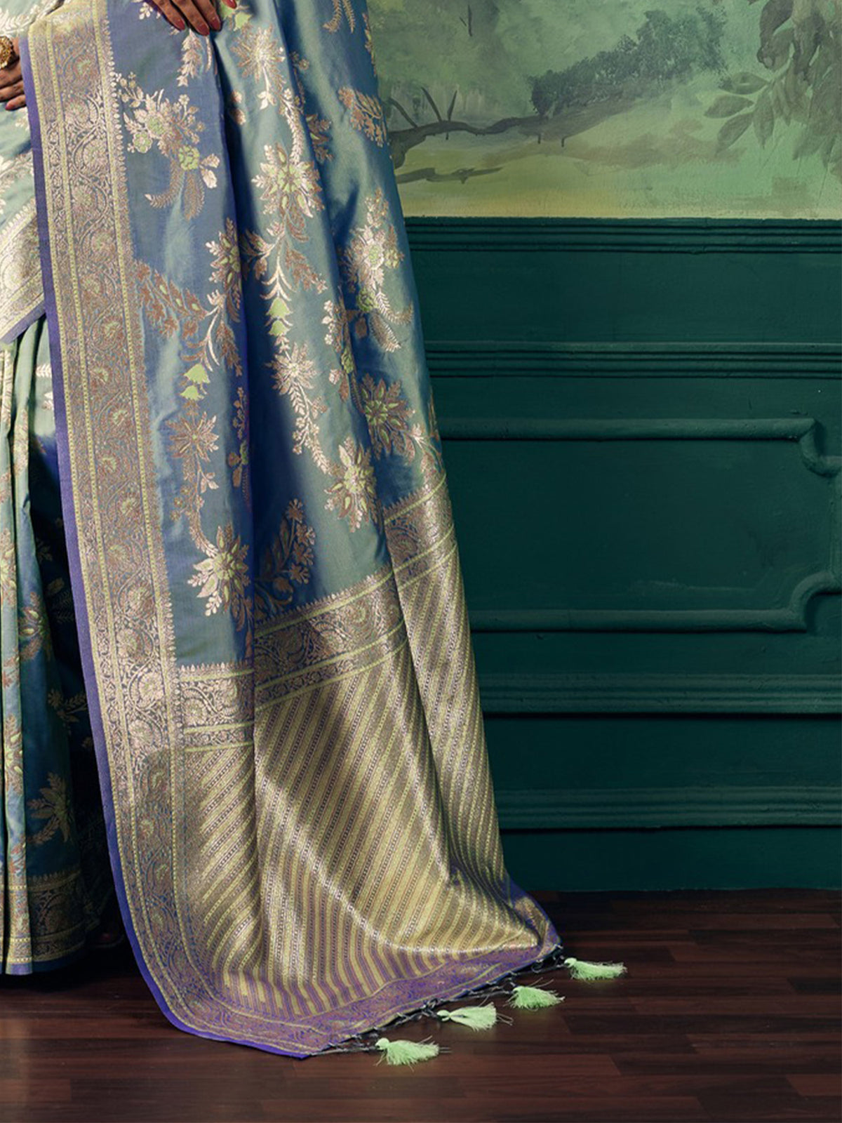 Pallu detail of light blue banarasi silk saree showing woven motif design and zari border
