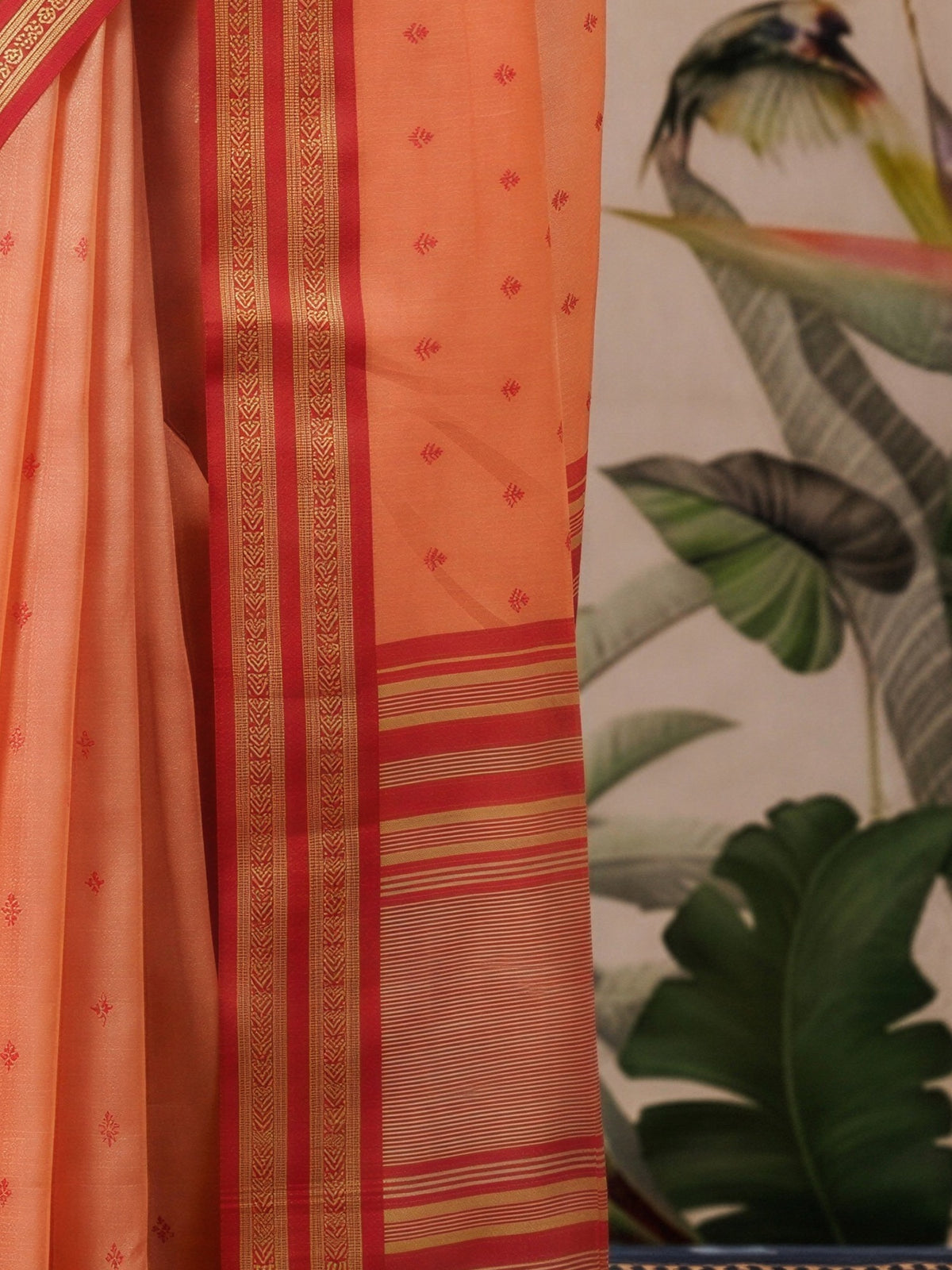 Pallu detail of peach cotton blend saree showing woven motif design and zari border