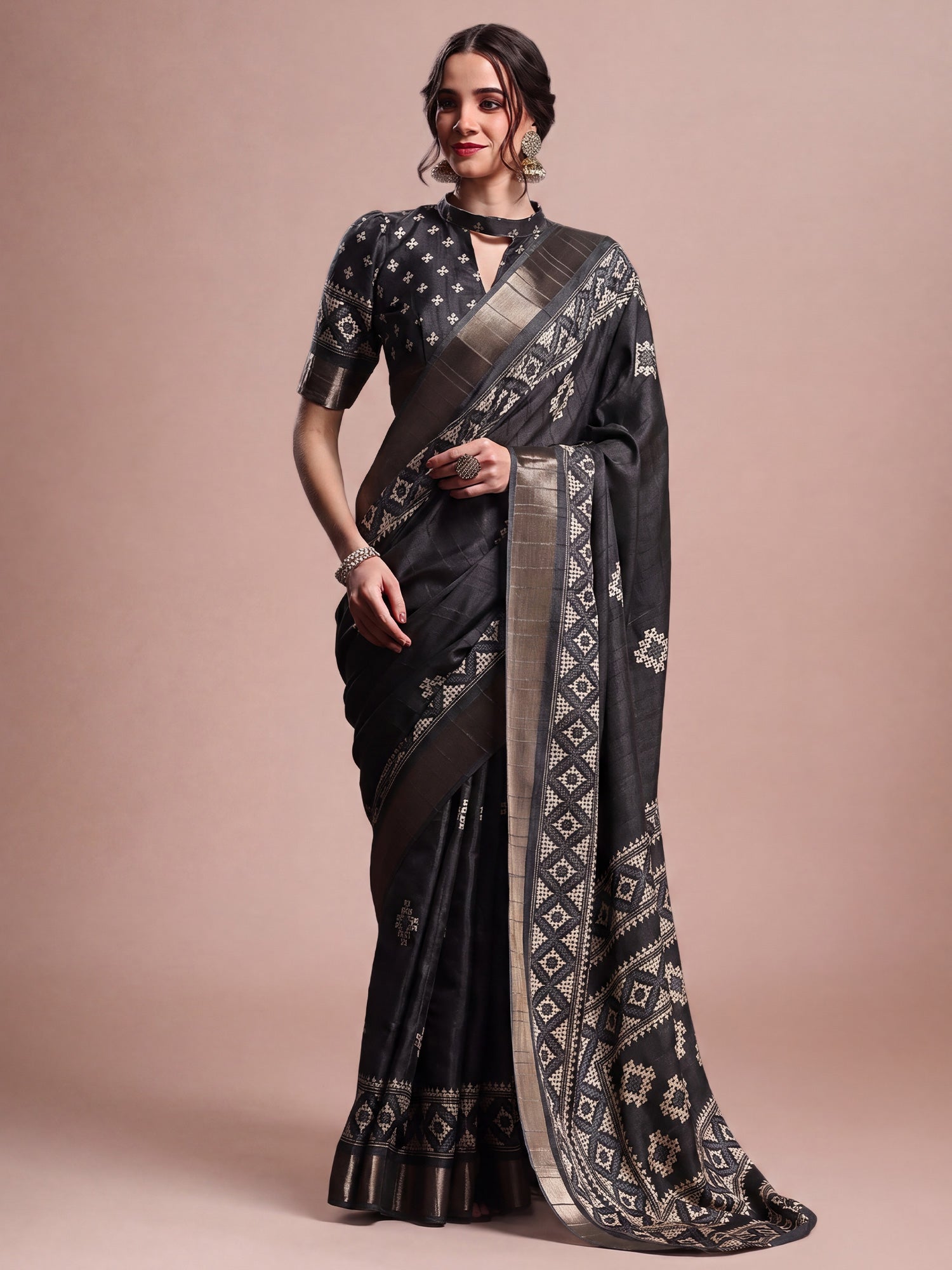 Woman wearing black silk blend saree with geometric pattern design and black blouse