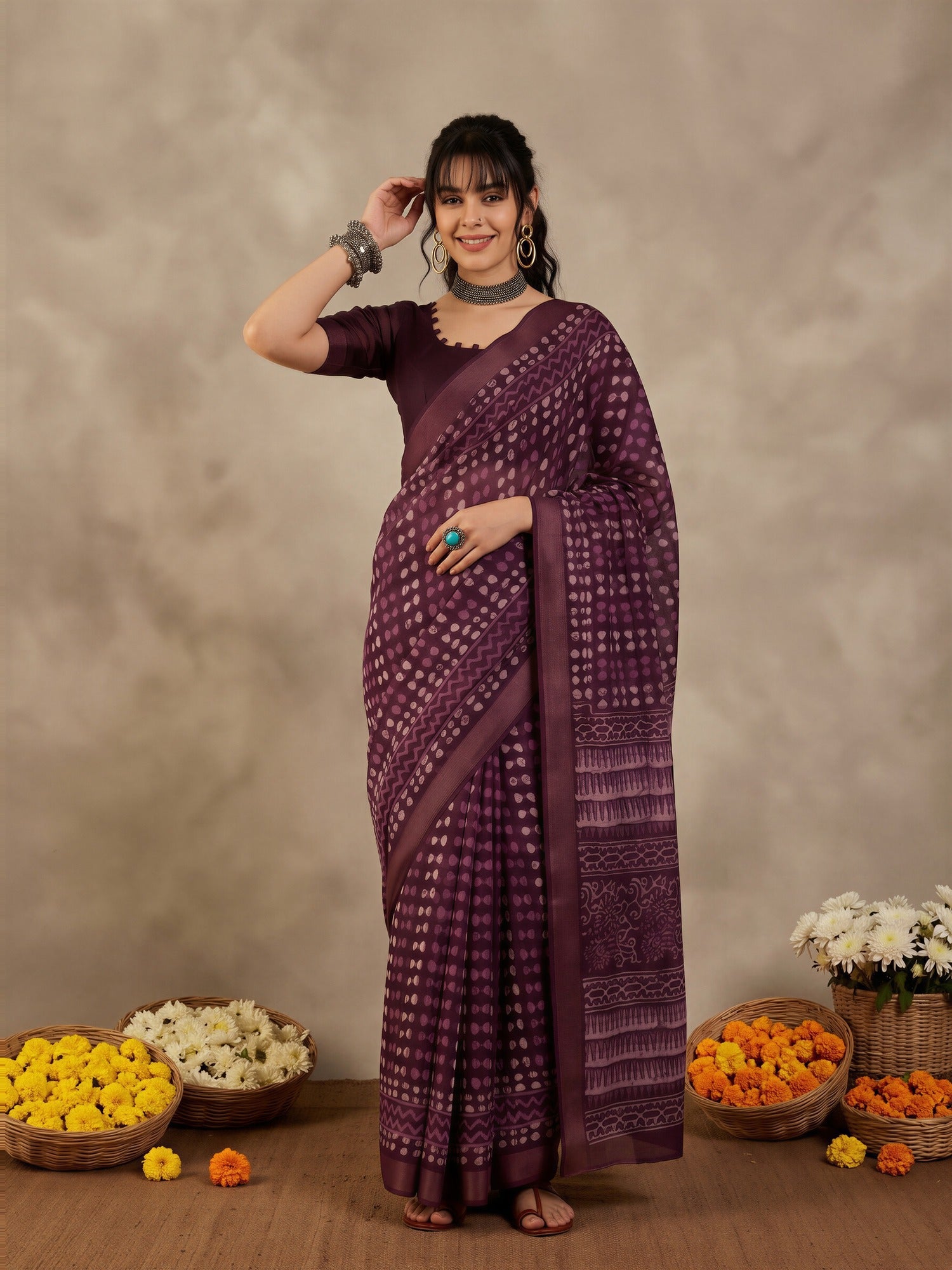Woman wearing violet cotton linen saree with traditional indian motif work and violet blouse