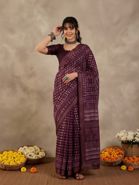 Woman wearing violet cotton linen saree with traditional indian motif work and violet blouse