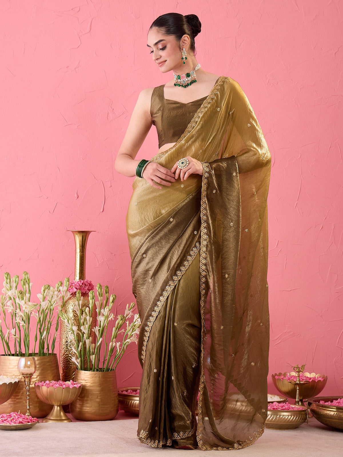 Woman wearing olive paper silk ready to wear saree with embroidered motif work and olive blouse