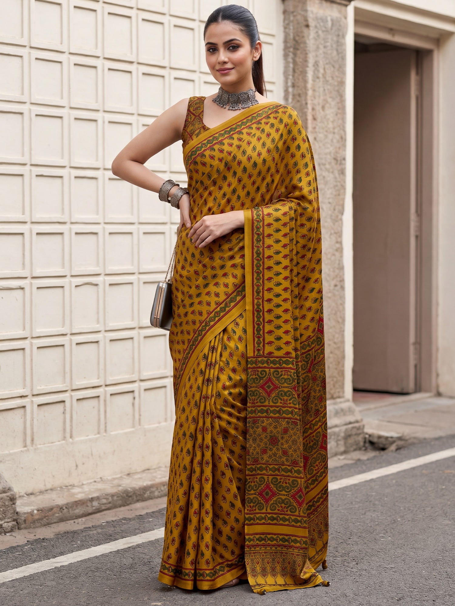 Woman wearing mustard pure crepe saree with ajrak block-print motif work and mustard blouse