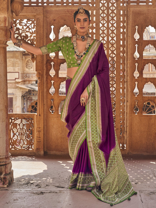 Woman wearing purple silk blend saree with clean solid-tone finish and olive blouse