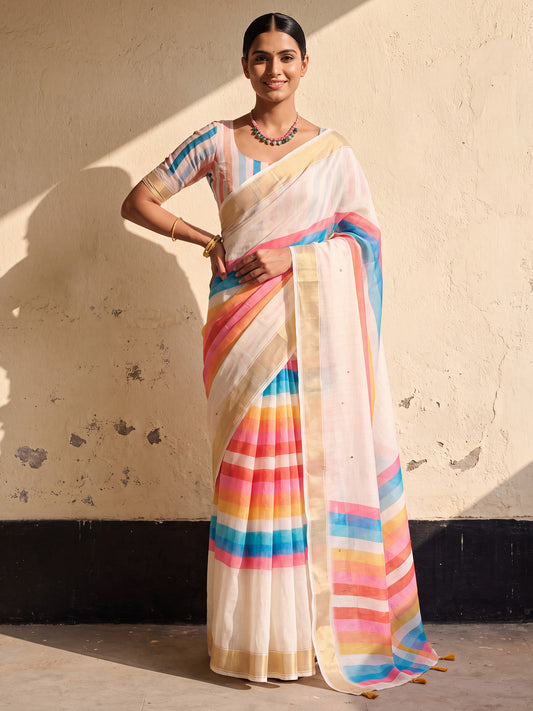 Woman wearing off white linen saree with colorblocked design and multicolored blouse