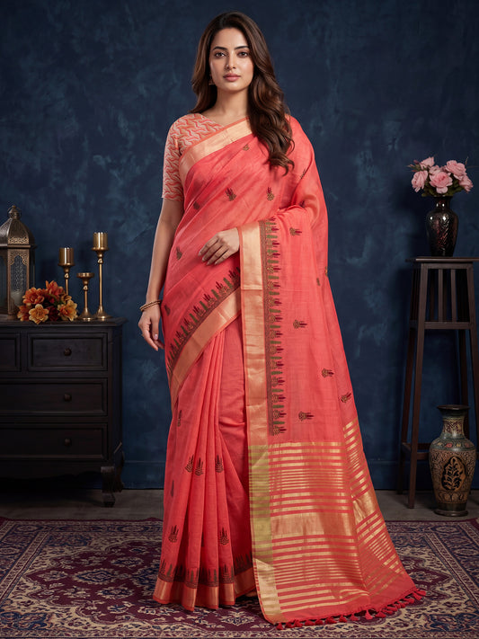 Woman wearing peach cotton linen saree with embroidered motif work and peach blouse