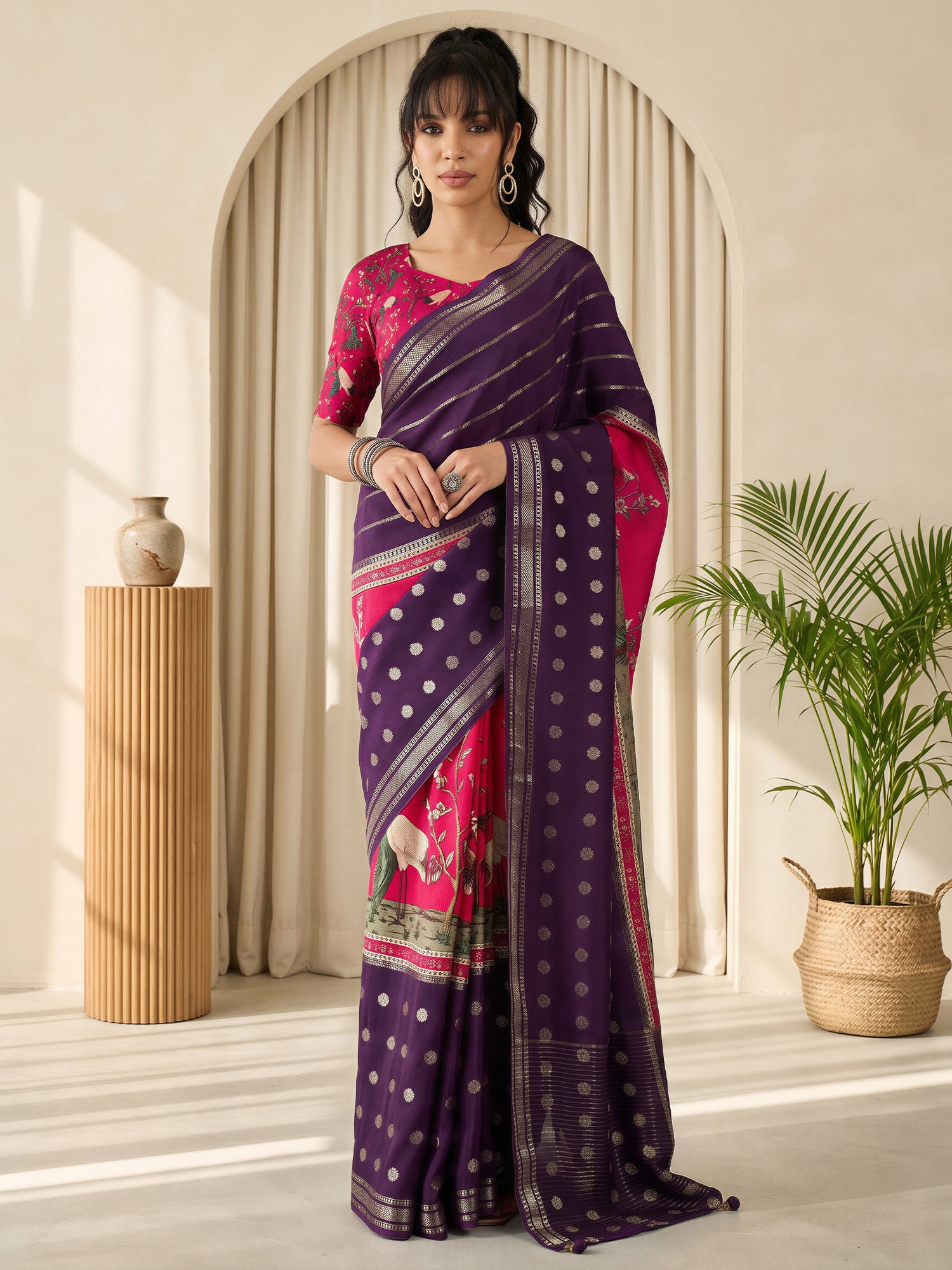 Woman wearing purple viscose silk saree with botanical floral and leaf design and pink blouse