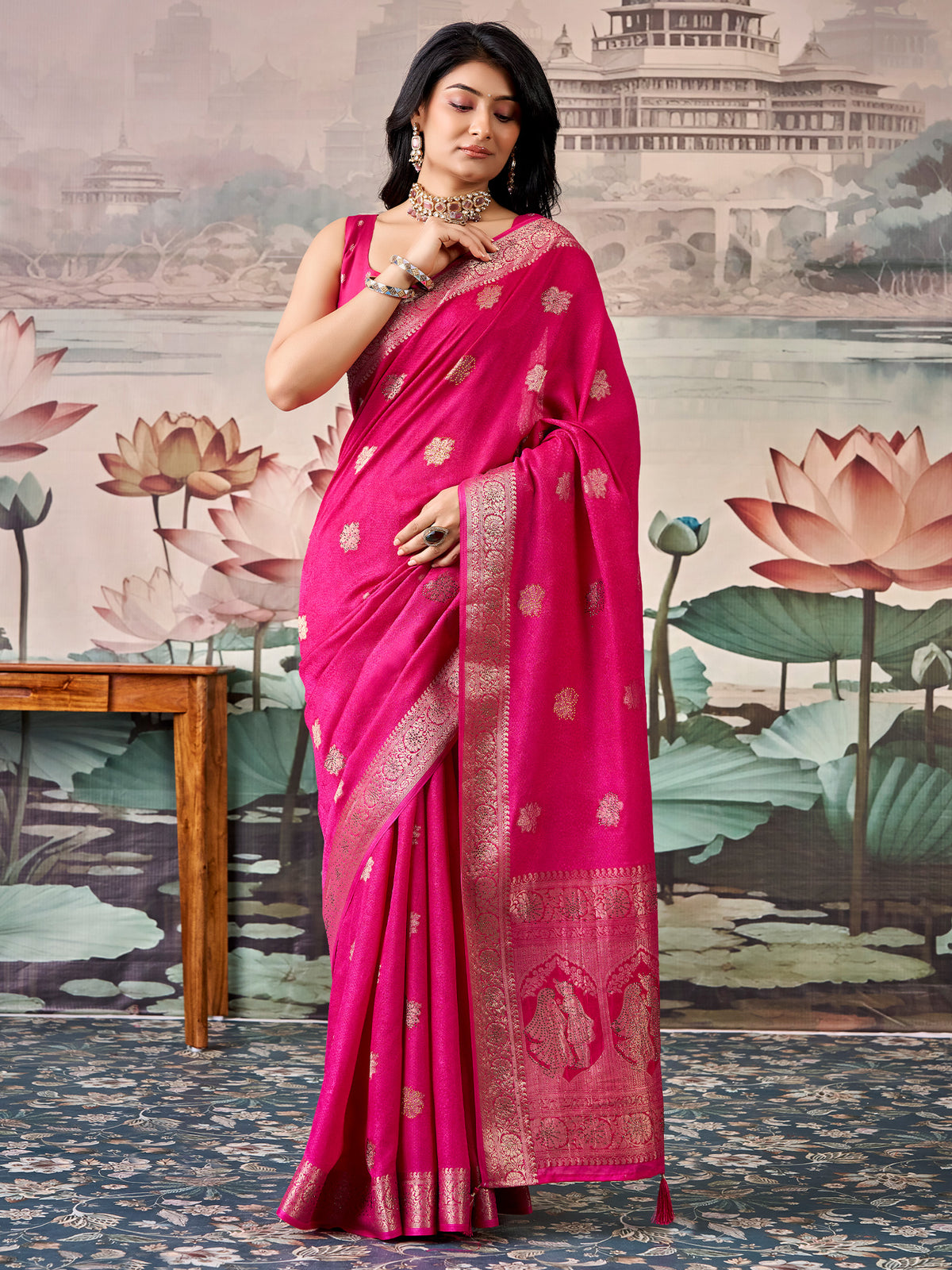 Woman wearing pink georgette saree with zari butta (metallic motif) work and pink blouse