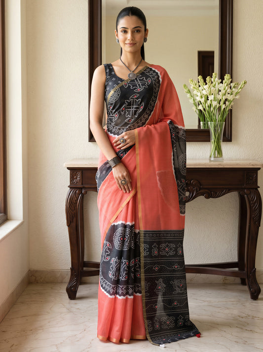 Woman wearing coral cotton blend saree with bandhani tie-dye dot work and black blouse