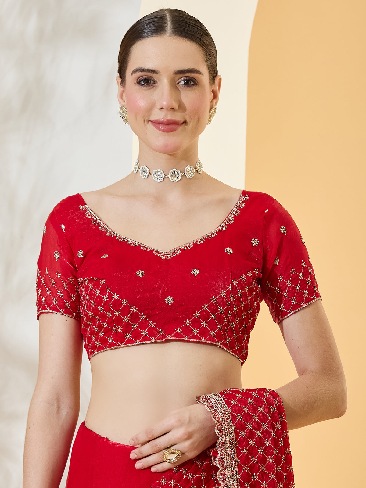 Unstitched red satin blouse piece with embroidered design