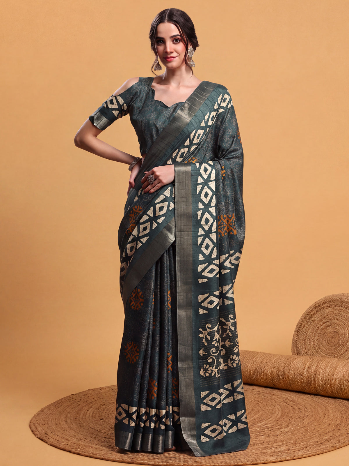 Woman wearing teal green silk blend saree with hand block-printed motifs and teal green blouse