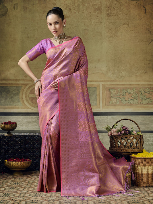 Woman wearing pink pure silk saree with woven motif design and pink blouse