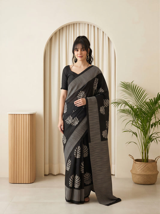 Woman wearing black bhagalpuri silk saree with batik wax-resist design and black blouse