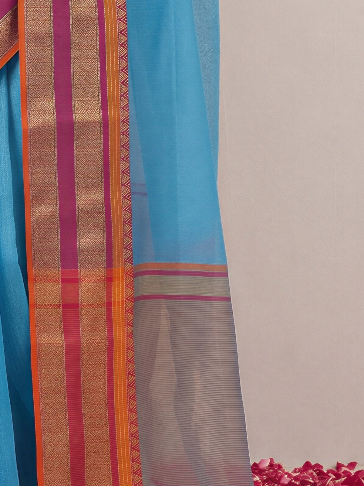 Pallu detail of light blue kota doria cotton saree showing clean solid-tone finish and zari border