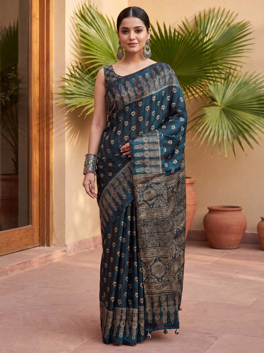 Woman wearing teal blue pure crepe saree with ajrak block-print motif work and teal blue blouse