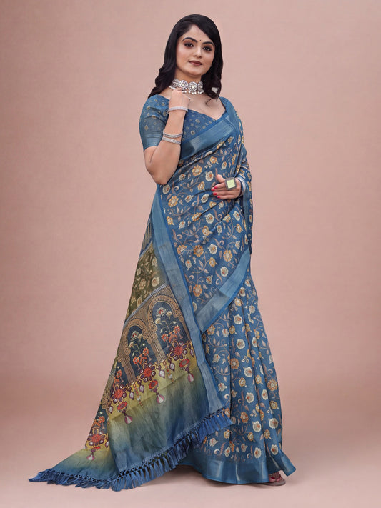 Woman wearing teal blue cotton silk saree with botanical floral and leaf design and teal blue blouse