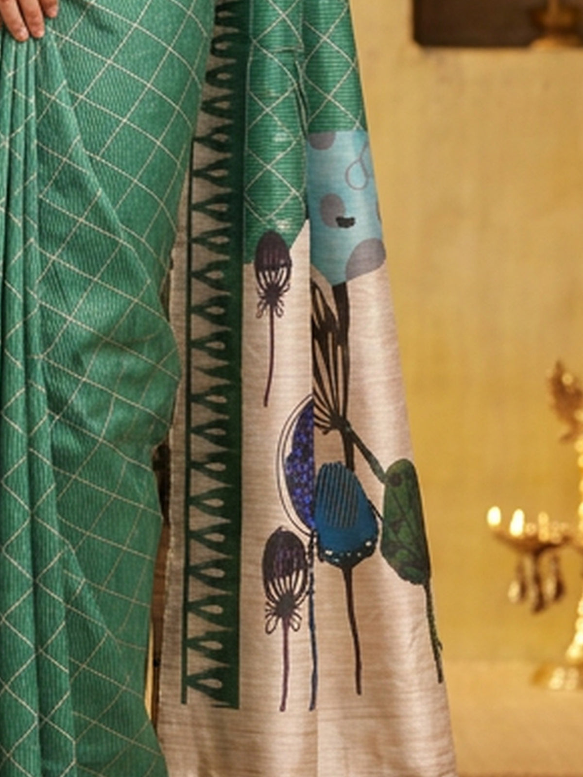 Pallu detail of light green soft silk saree showing geometric pattern design and printed border