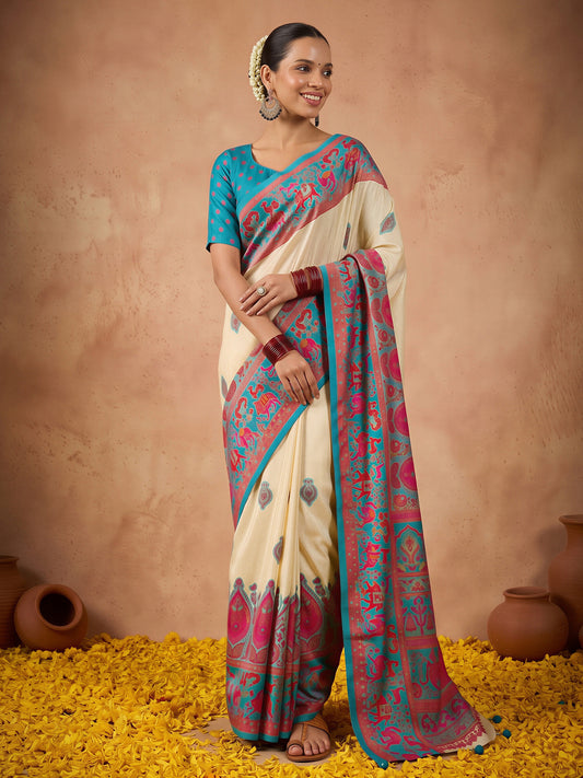 Woman wearing teal blue silk blend saree with metallic foil print work and teal blue blouse