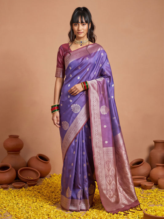 Woman wearing purple cotton blend saree with ornamented surface design and brown blouse