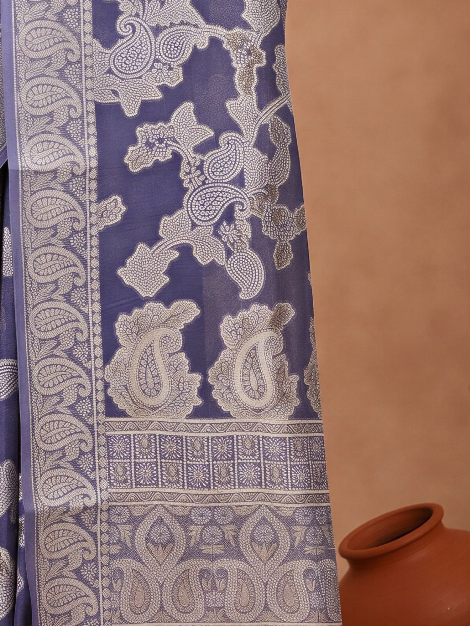 Pallu detail of navy blue organza saree showing traditional indian motif work and zari border
