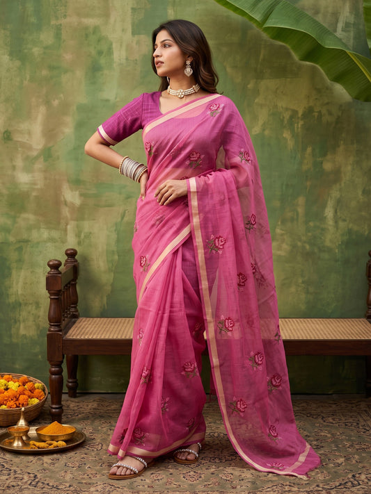 Woman wearing magenta kota doria cotton saree with embroidered motif work and purple blouse