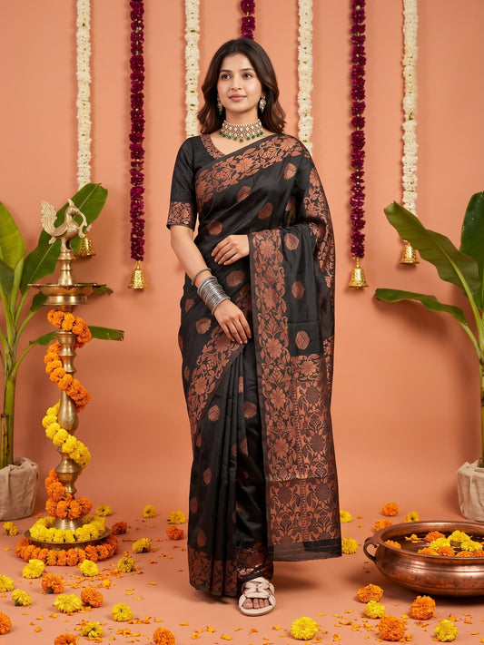 Woman wearing black silk blend saree with zari butta (metallic motif) work and black blouse