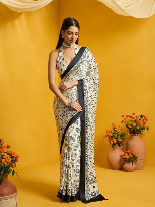 Woman wearing off white satin silk saree with ajrak block-print motif work and off white blouse