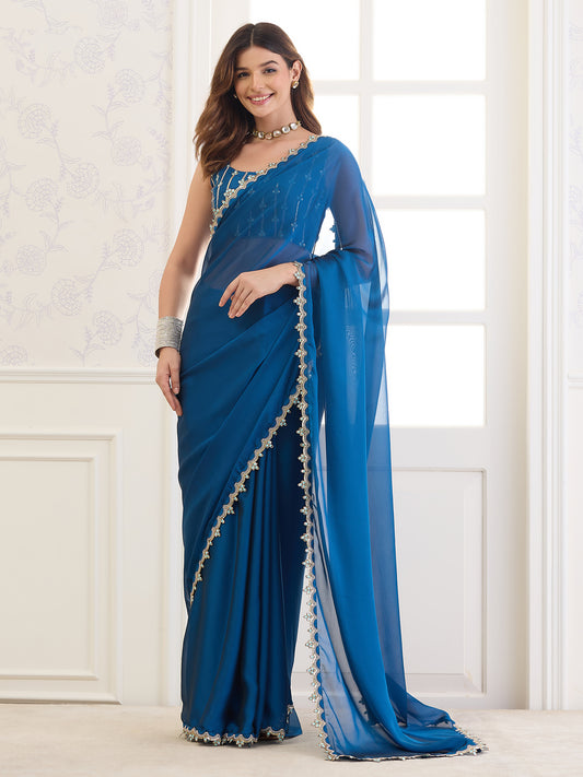 Woman wearing blue pure georgette saree with clean solid-tone finish and blue blouse