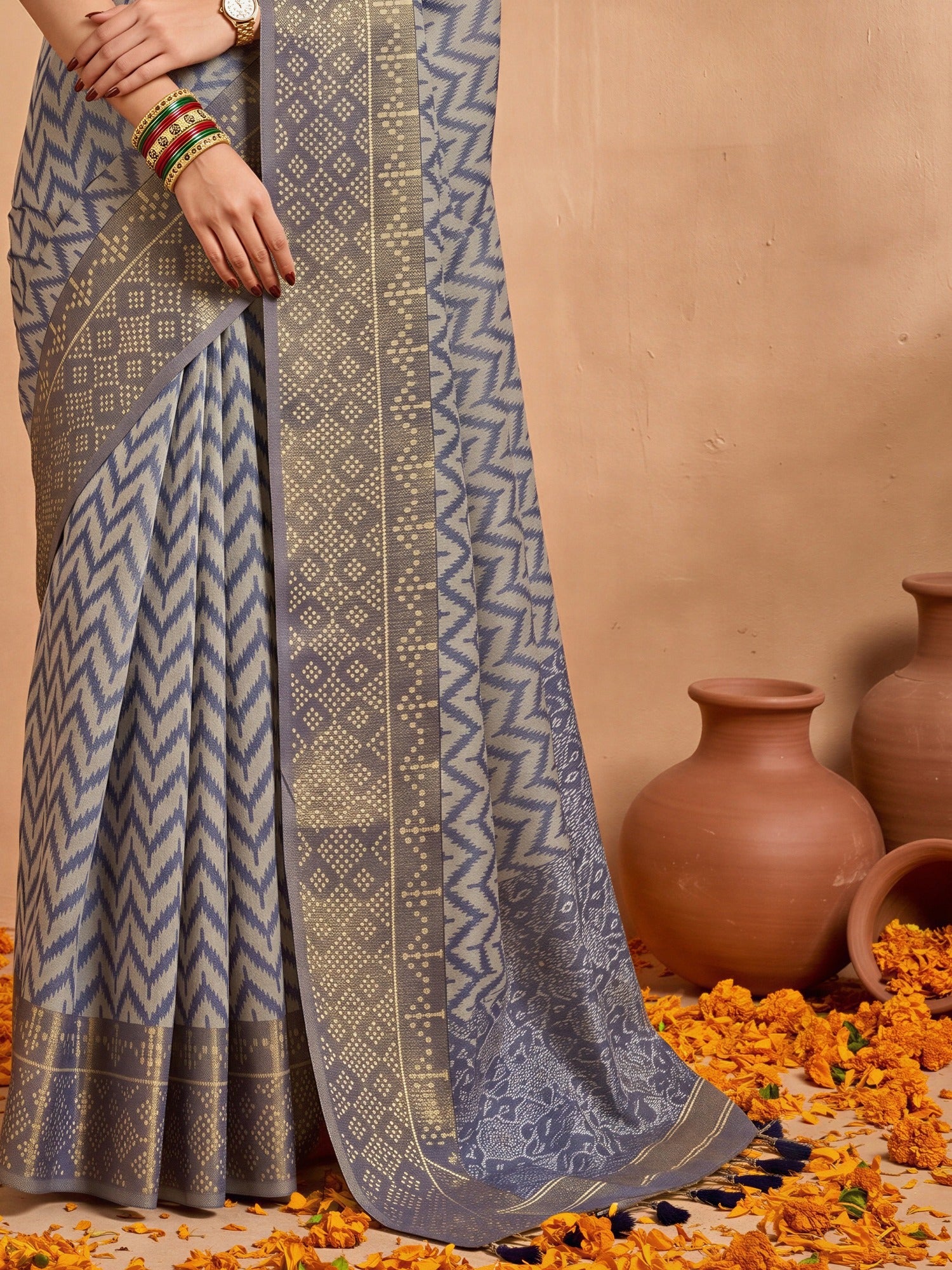 Pallu detail of blue viscose saree showing geometric pattern design and zari border