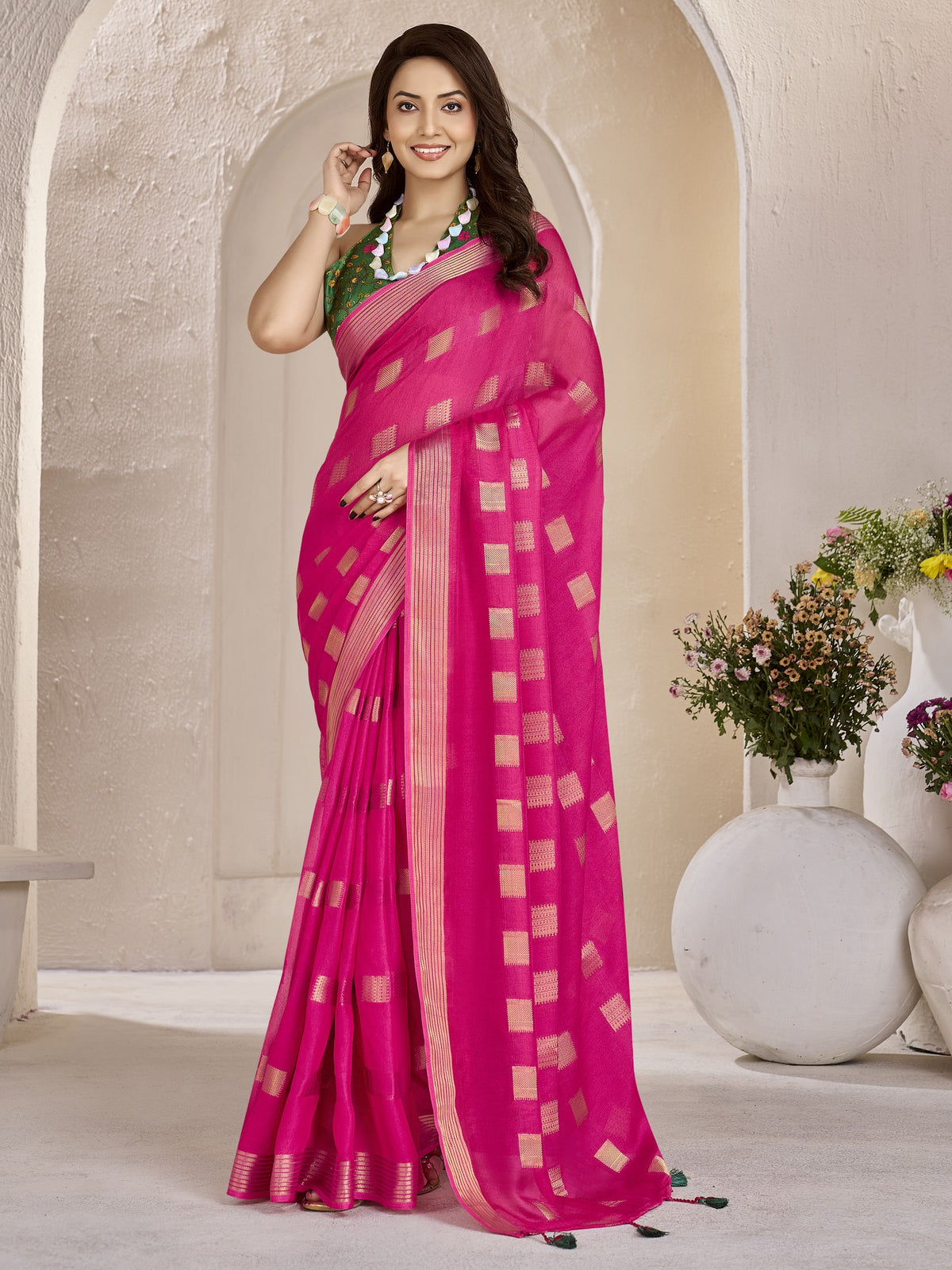 Pink zari butta georgette saree with green blouse piece