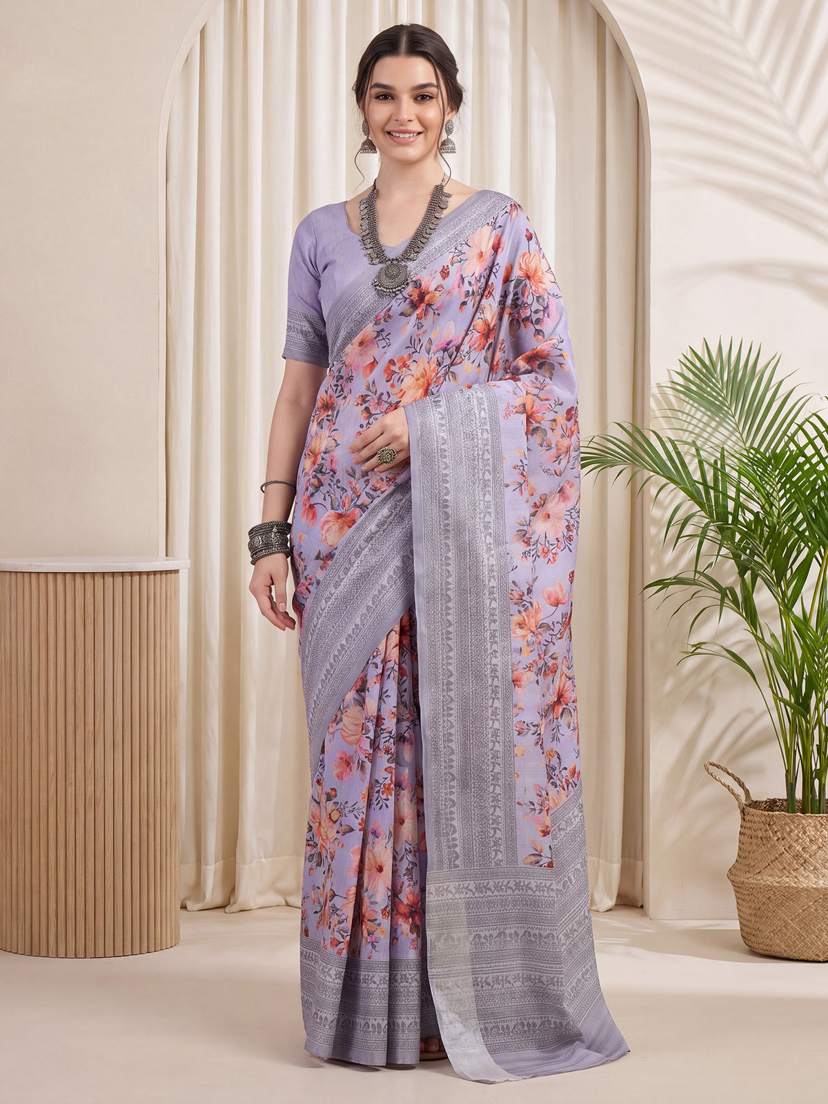Woman wearing lavender silk blend saree with botanical floral and leaf design and lavender blouse