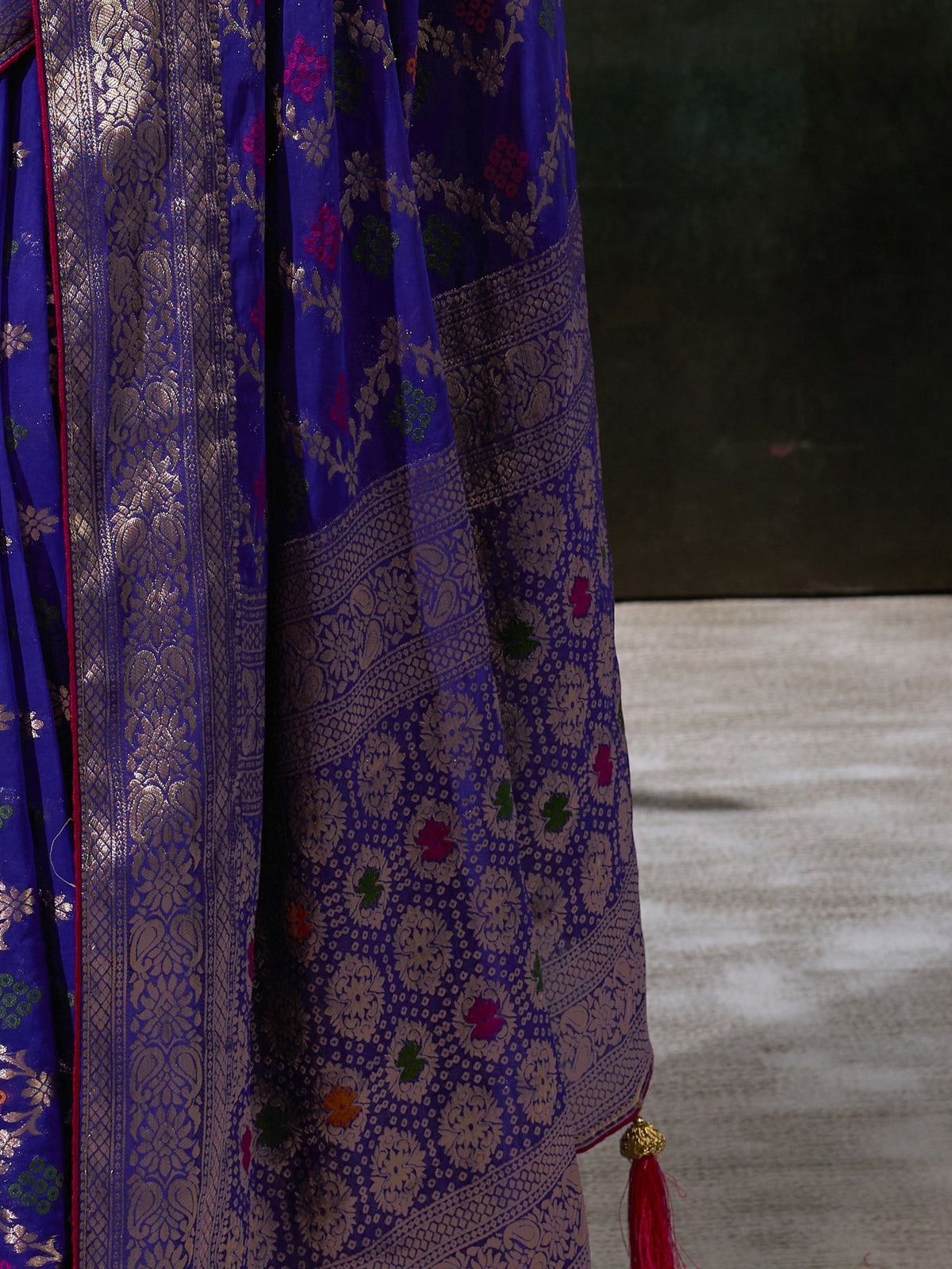 Pallu detail of blue georgette saree showing woven motif design and zari border