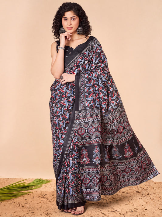 Woman wearing black dola silk saree with ajrak block-print motif work and black blouse