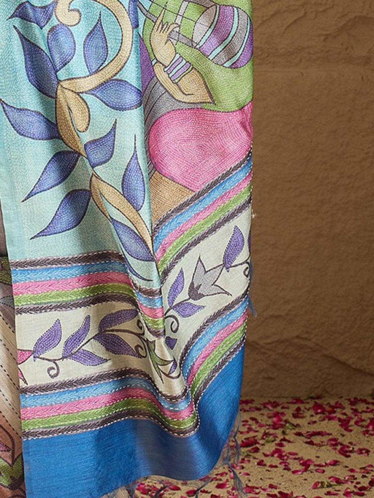 Pallu detail of multicolored art silk saree showing kalamkari narrative motif work and printed border