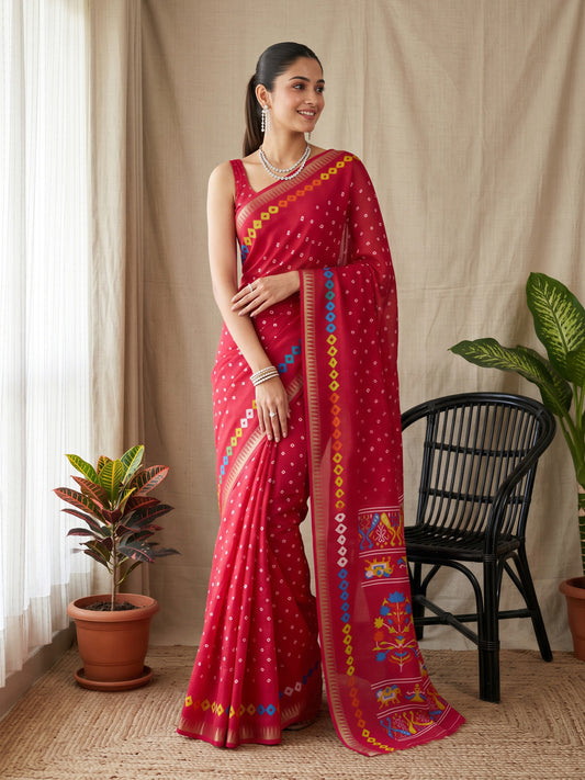 Woman wearing pink georgette saree with bandhani tie-dye dot work and pink blouse