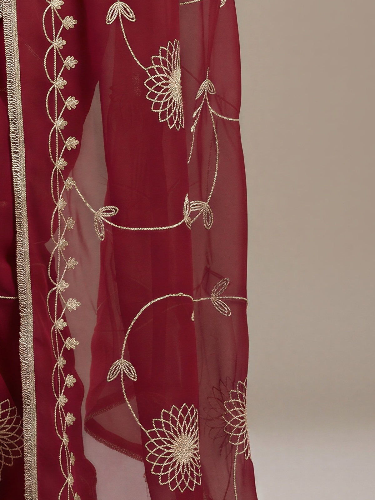 Pallu detail of pink georgette saree showing embroidered motif work and embellished border