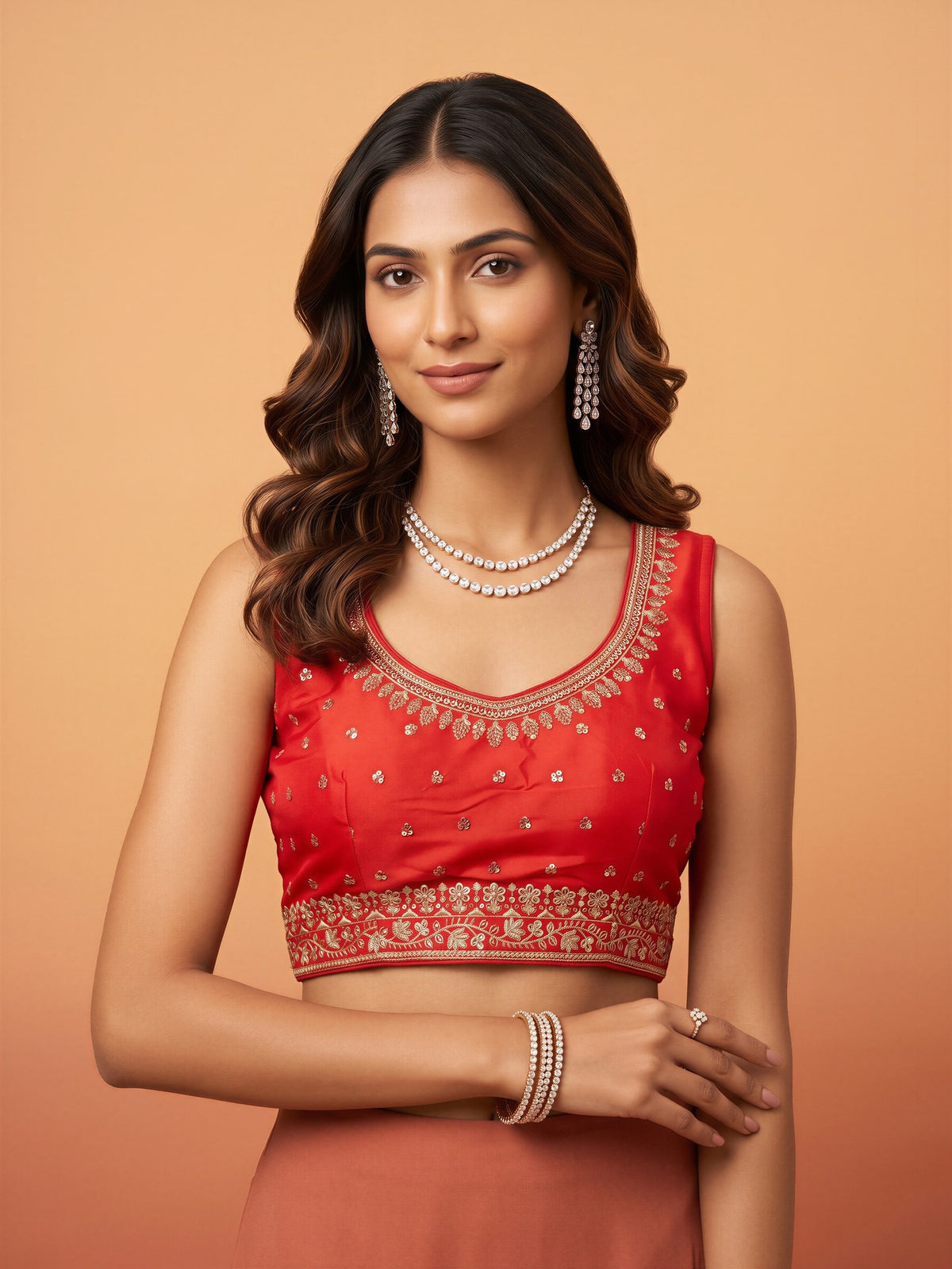 Orange sequin embellished silk blend sleeveless readymade saree blouse with round neck