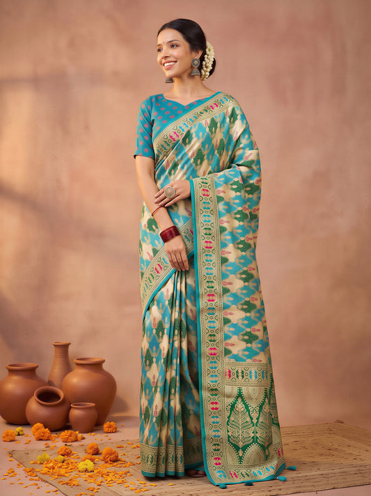 Woman wearing teal blue silk blend saree with metallic foil print work and teal blue blouse