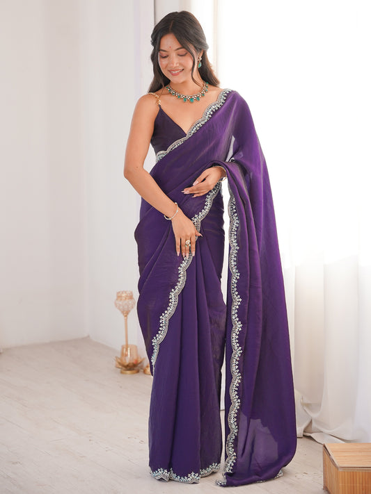 Woman wearing purple silk blend saree with clean solid-tone finish and purple blouse